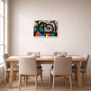 Unframed poster print of Joan Miró's 'Le Lezard Aux Plumes D'or' displayed on a wall in a dining room