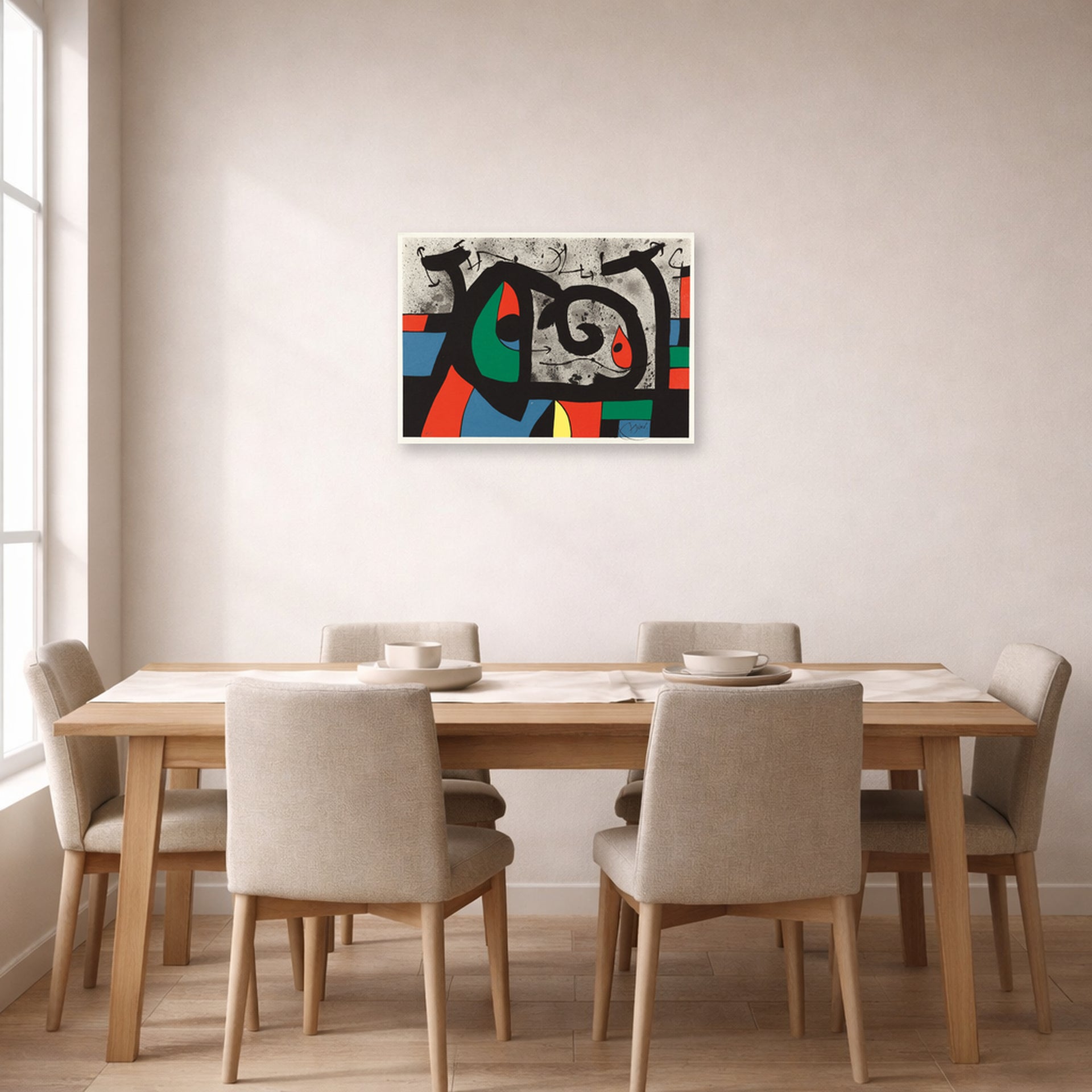Unframed poster print of Joan Miró's 'Le Lezard Aux Plumes D'or' displayed on a wall in a dining room