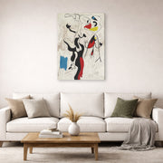 Gallery-wrapped canvas print of Joan Miró's 'Man and Woman' displayed on a wall in a living room