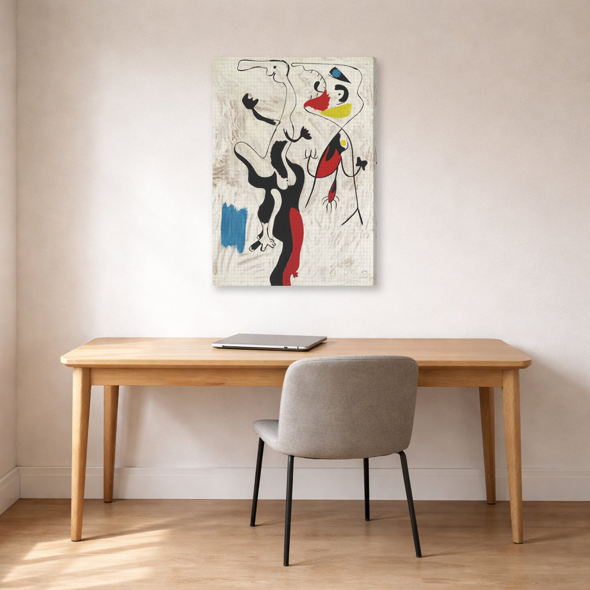 Gallery-wrapped canvas print of Joan Miró's 'Man and Woman' displayed on a wall in a office