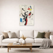 Unframed poster print of Joan Miró's 'Man and Woman' displayed on a wall in a living room