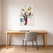 Unframed poster print of Joan Miró's 'Man and Woman' displayed on a wall in a office