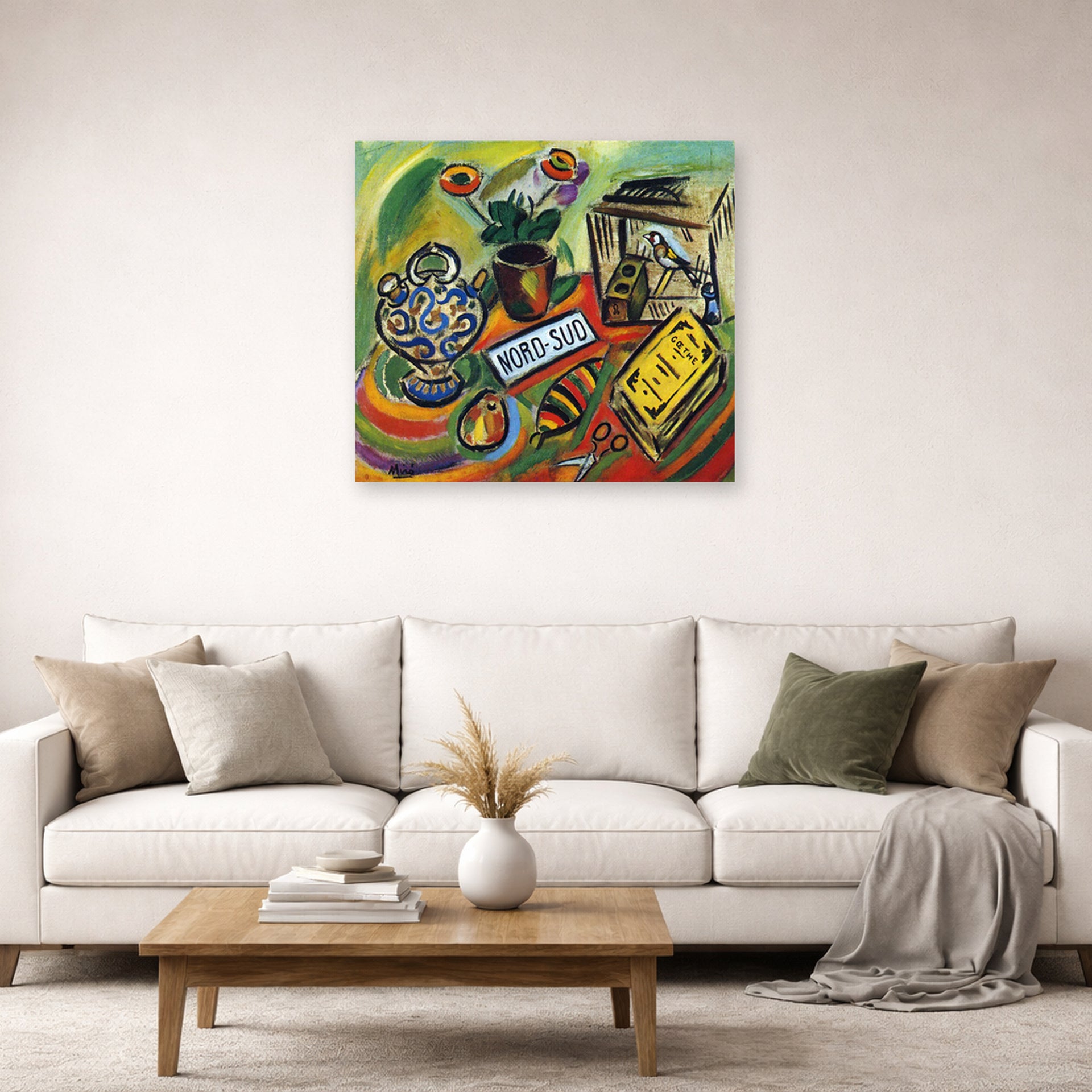 Unframed poster print of Joan Miró's 'North South' displayed on a wall in a living room