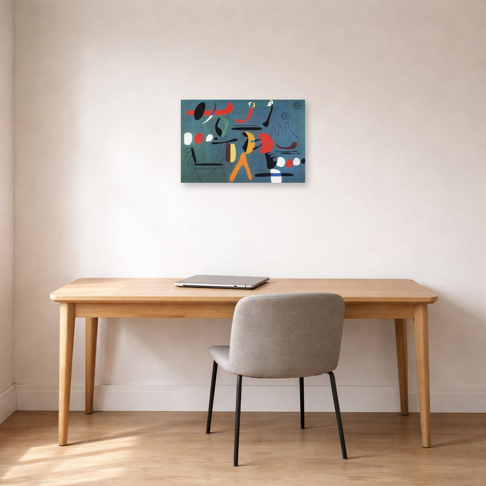 Unframed poster print of Joan Miró's 'Painting 1925-1964' displayed on a wall in a office