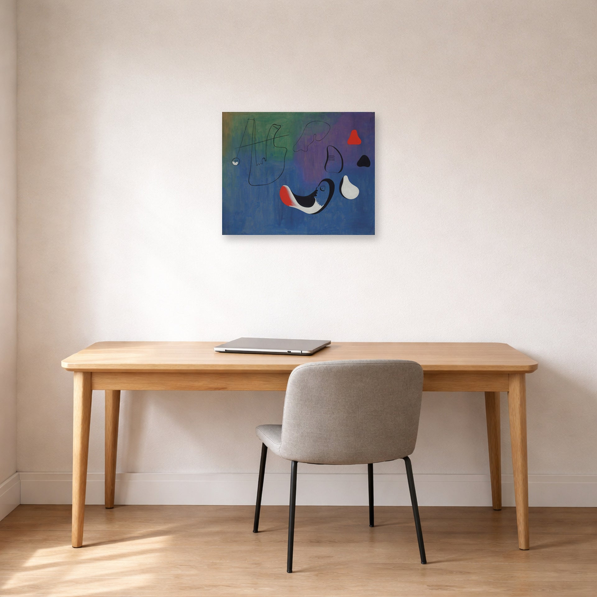 Unframed poster print of Joan Miró's 'Peinture,1933' displayed on a wall in a office