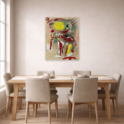 Unframed poster print of Joan Miró's 'Two Figures and a Dragonfly' displayed on a wall in a dining room