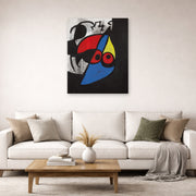 Unframed poster print of Joan Miró's 'Woman, Bird' displayed on a wall in a living room