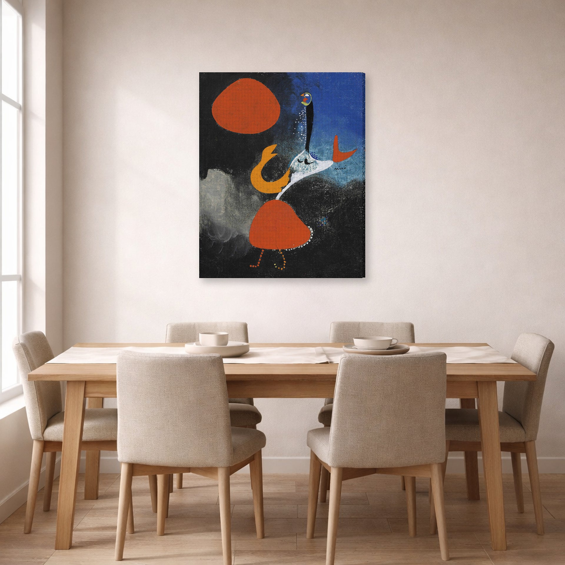 Gallery-wrapped canvas print of Joan Miró's 'Woman in Front of the Sun' displayed on a wall in a dining room