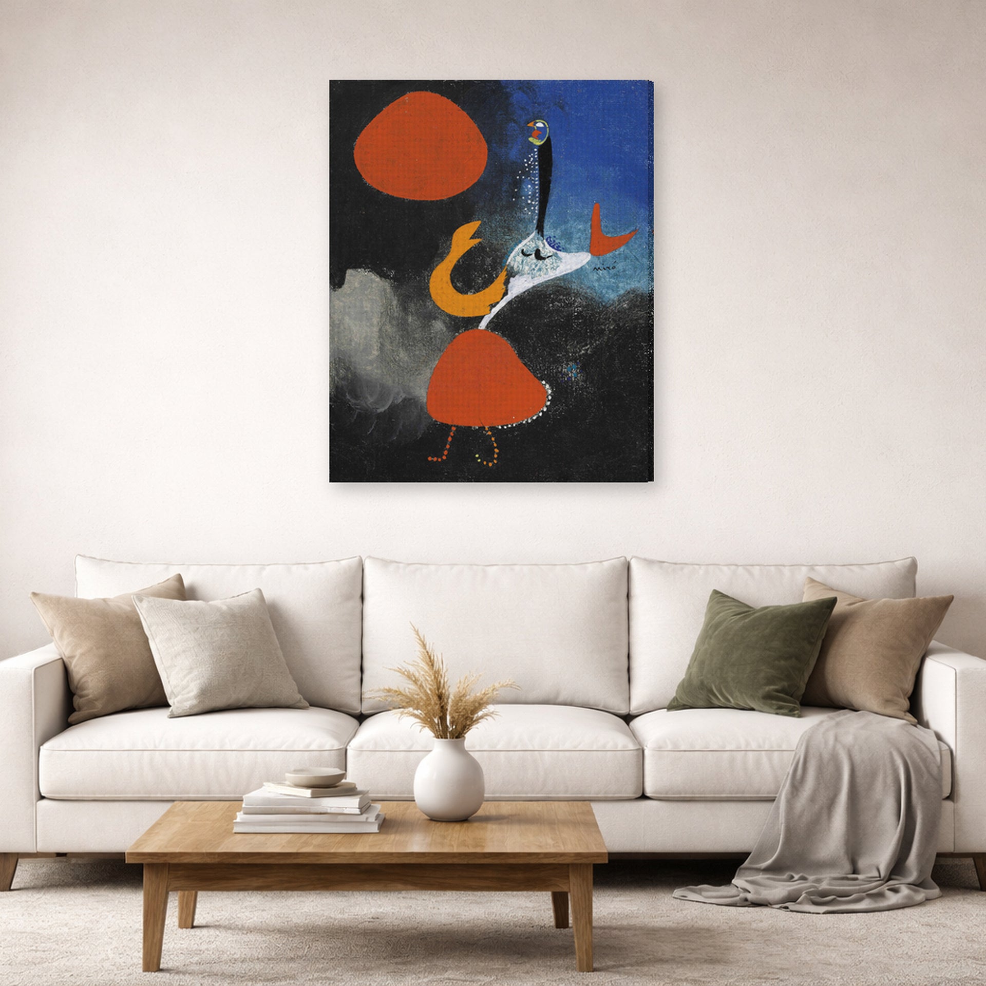Gallery-wrapped canvas print of Joan Miró's 'Woman in Front of the Sun' displayed on a wall in a living room