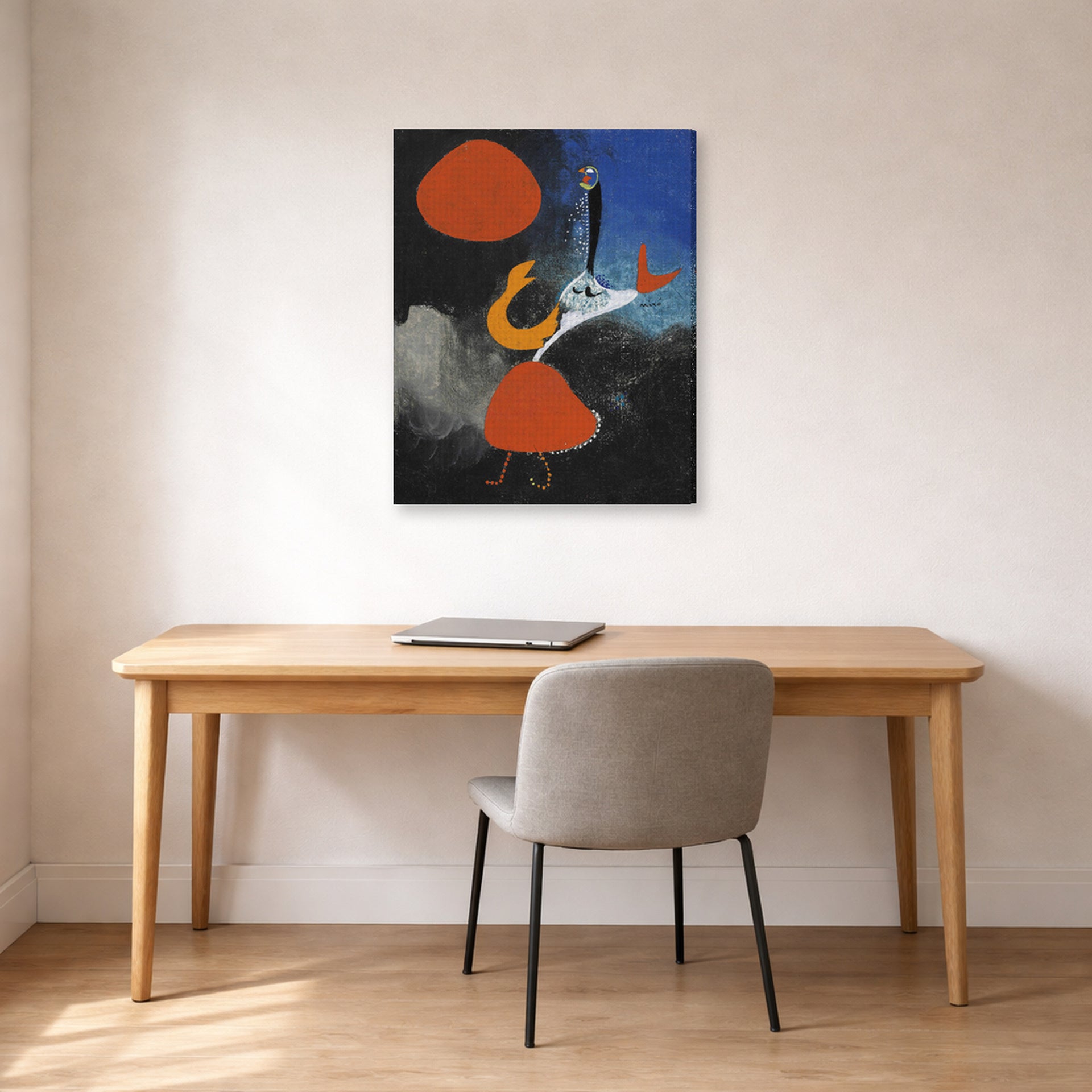 Gallery-wrapped canvas print of Joan Miró's 'Woman in Front of the Sun' displayed on a wall in a office