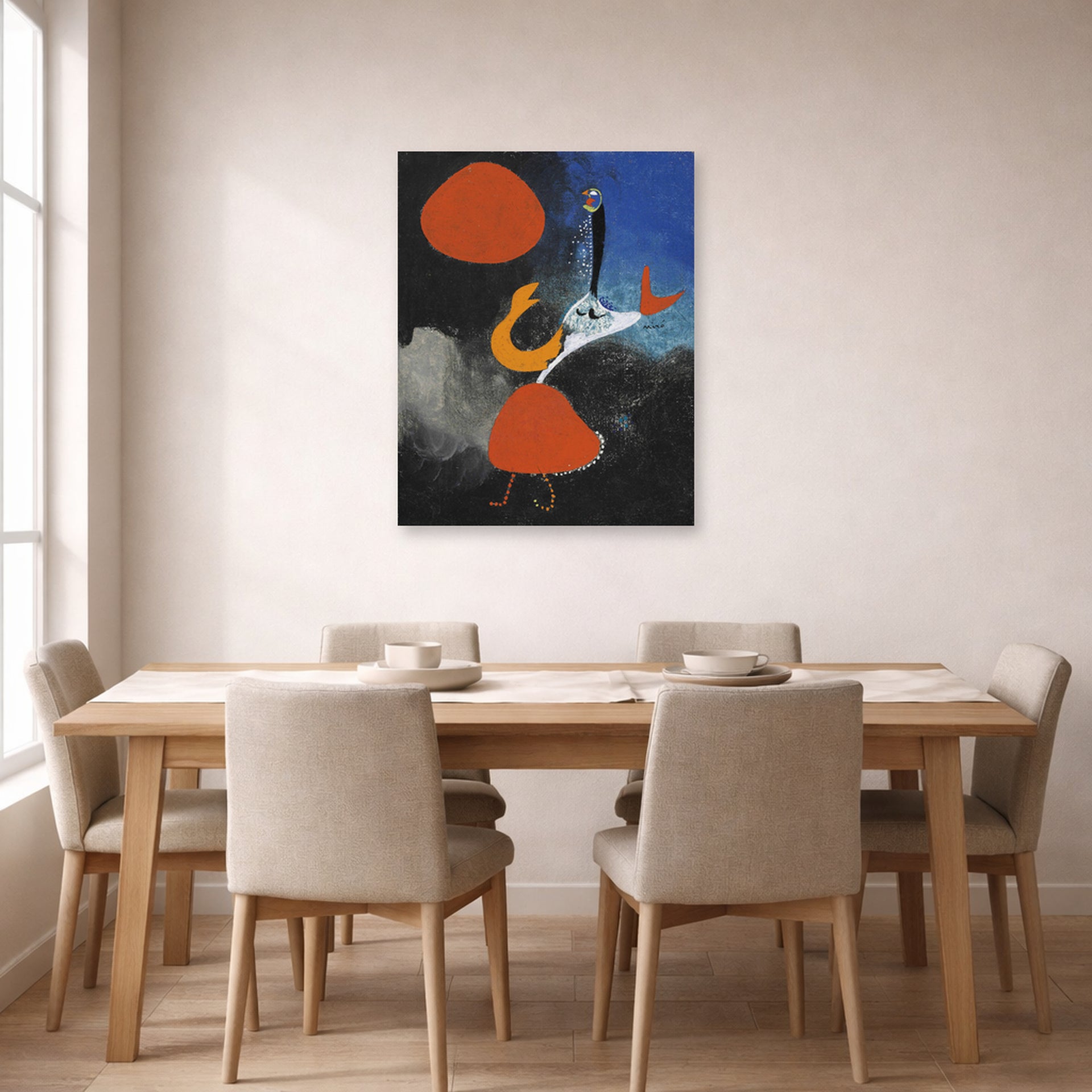 Unframed poster print of Joan Miró's 'Woman in Front of the Sun' displayed on a wall in a dining room