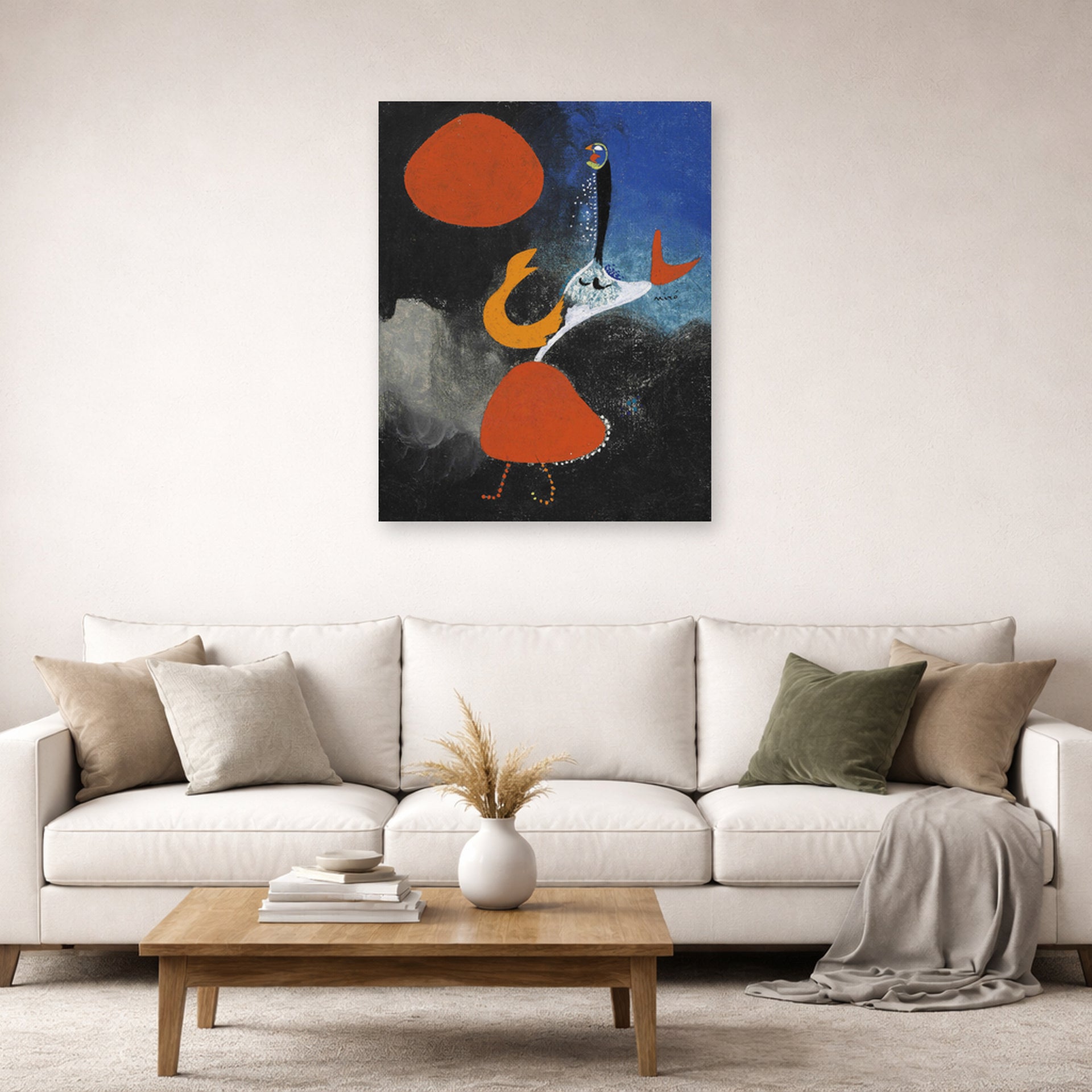 Unframed poster print of Joan Miró's 'Woman in Front of the Sun' displayed on a wall in a living room
