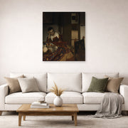 Unframed poster print of Johannes Vermeer's A Maid Sleep displayed on a wall in a living room