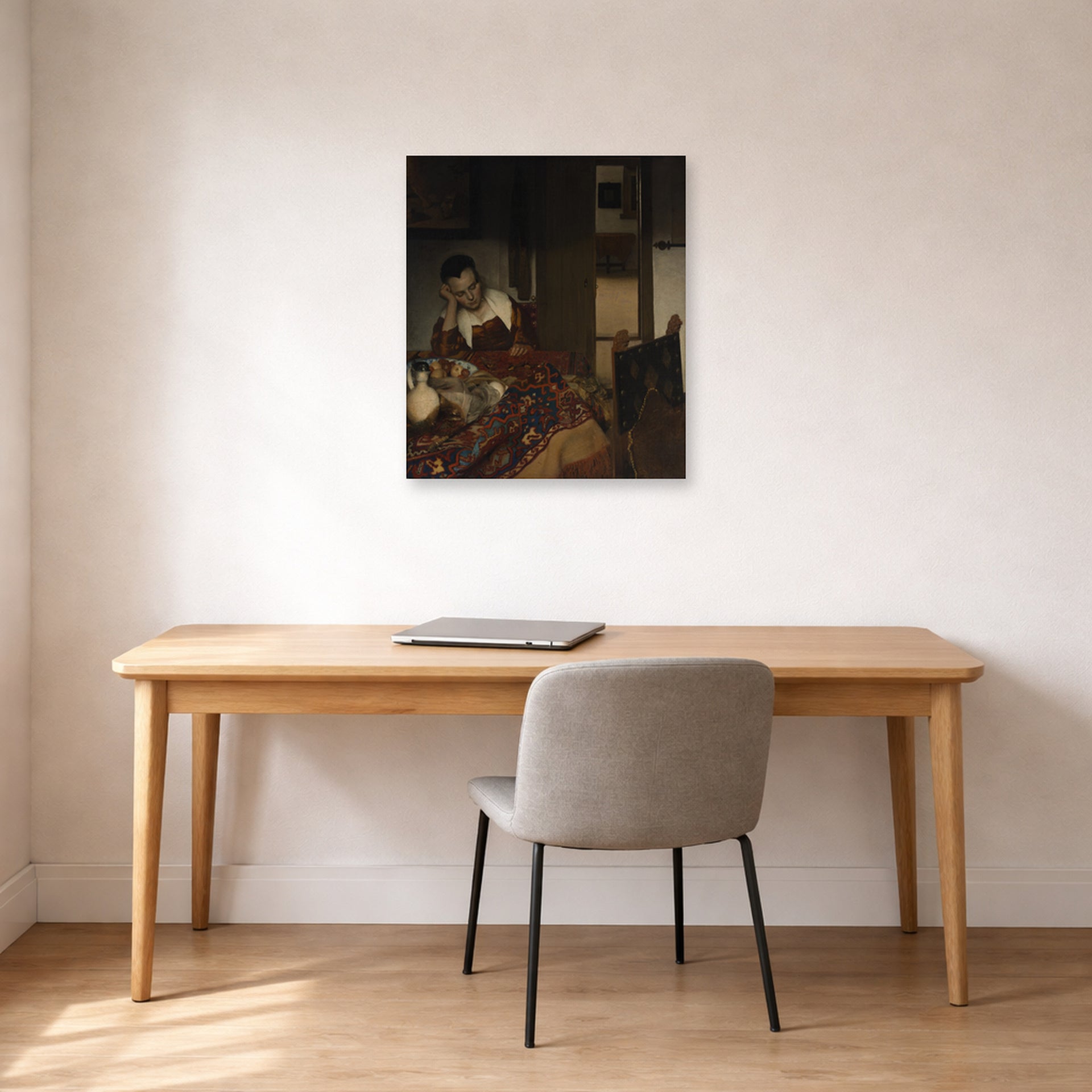 Unframed poster print of Johannes Vermeer's A Maid Sleep displayed on a wall in a office