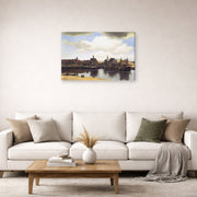 Gallery-wrapped canvas print of Johannes Vermeer's View of Delft displayed on a wall in a living room