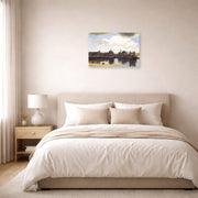 Unframed poster print of Johannes Vermeer's View of Delft displayed on a wall in a bedroom