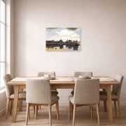 Unframed poster print of Johannes Vermeer's View of Delft displayed on a wall in a dining room