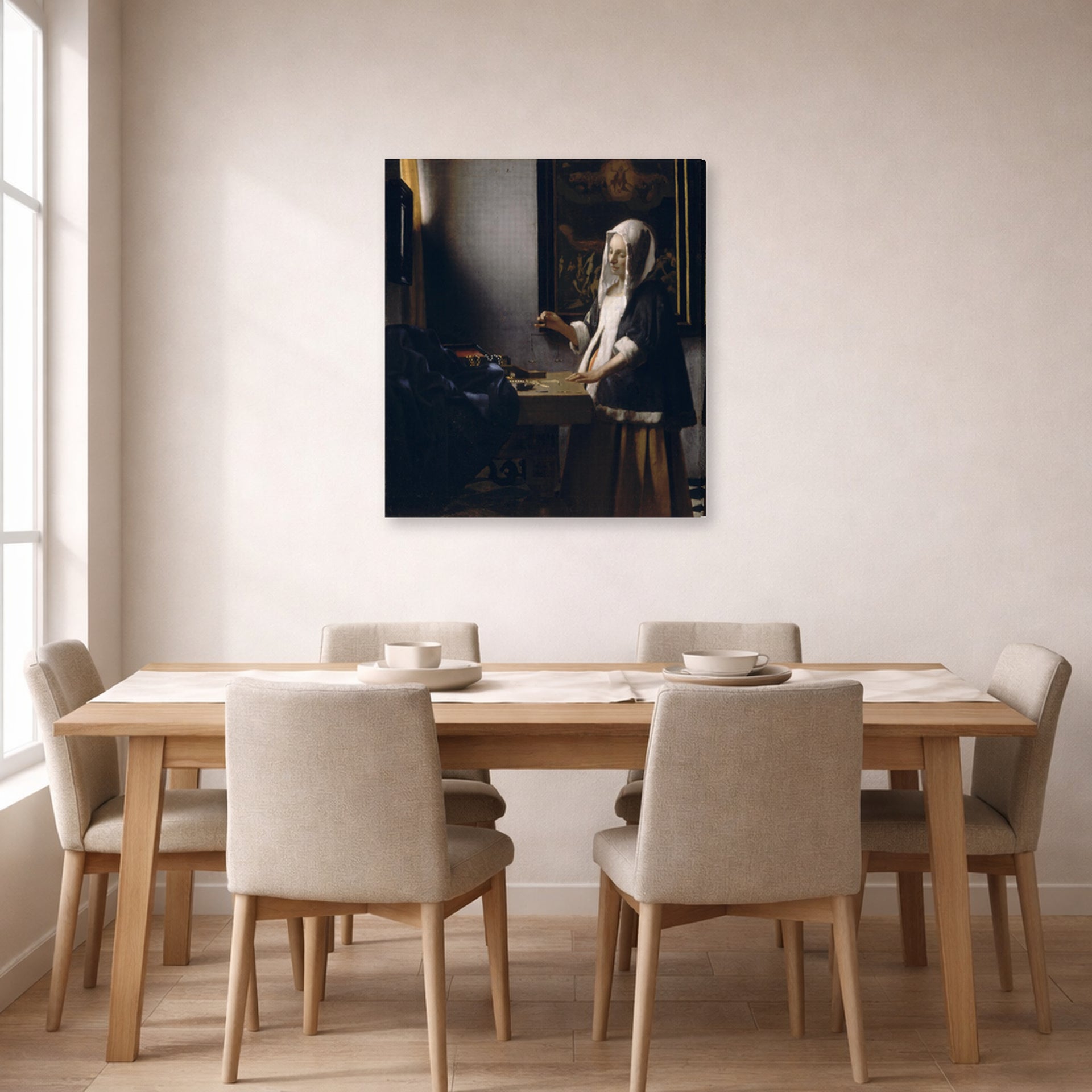 Gallery-wrapped canvas print of Johannes Vermeer's Woman Holding a Balance displayed on a wall in a dining room