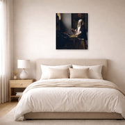 Unframed poster print of Johannes Vermeer's Woman Holding a Balance displayed on a wall in a bedroom
