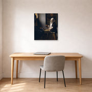 Unframed poster print of Johannes Vermeer's Woman Holding a Balance displayed on a wall in a office