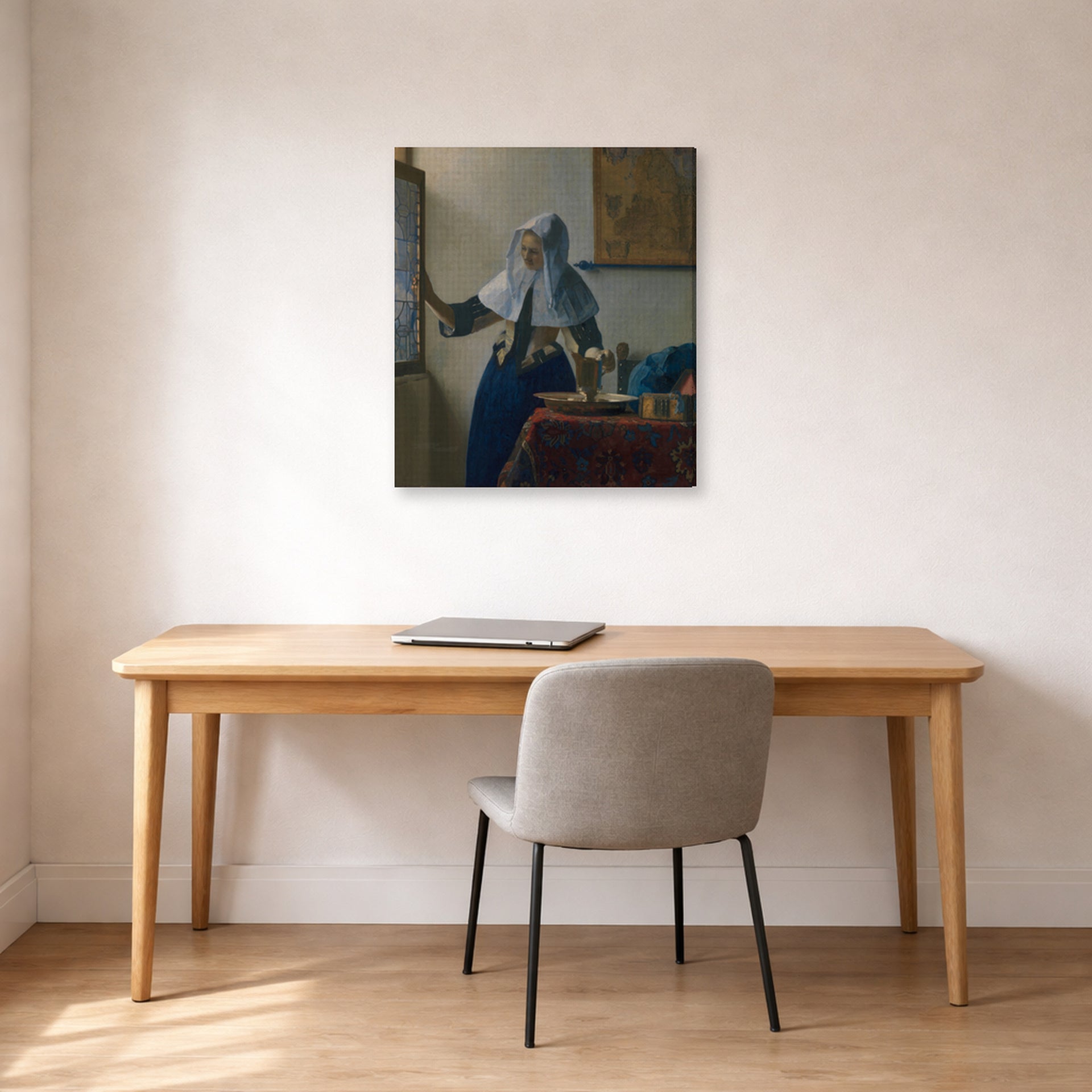 Gallery-wrapped canvas print of Johannes Vermeer's Young Woman with a Water Pitcher displayed on a wall in a office