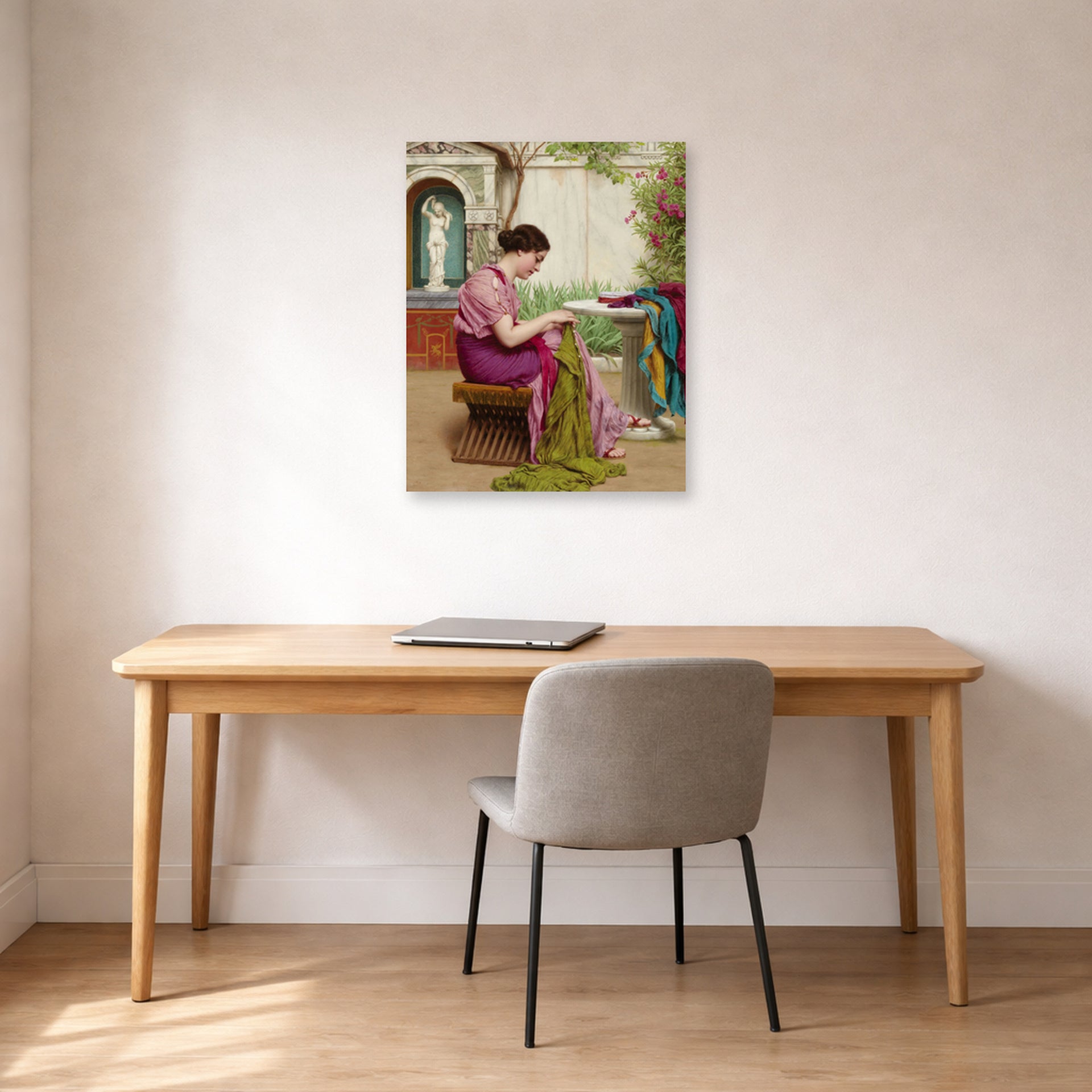 Unframed poster print of John William Godward's A Stitch in Time displayed on a wall in an office