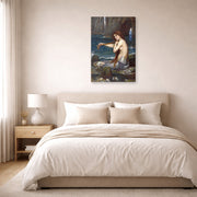 Gallery-wrapped canvas print of John William Waterhouse's A Mermaid displayed on a wall in a bedroom