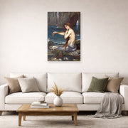 Unframed poster print of John William Waterhouse's A Mermaid displayed on a wall in a living room