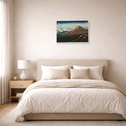 Unframed poster print of Katsushika Hokusai's Shower Below the Summit displayed on a wall in a bedroom