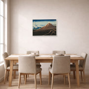 Unframed poster print of Katsushika Hokusai's Shower Below the Summit displayed on a wall in a dining room