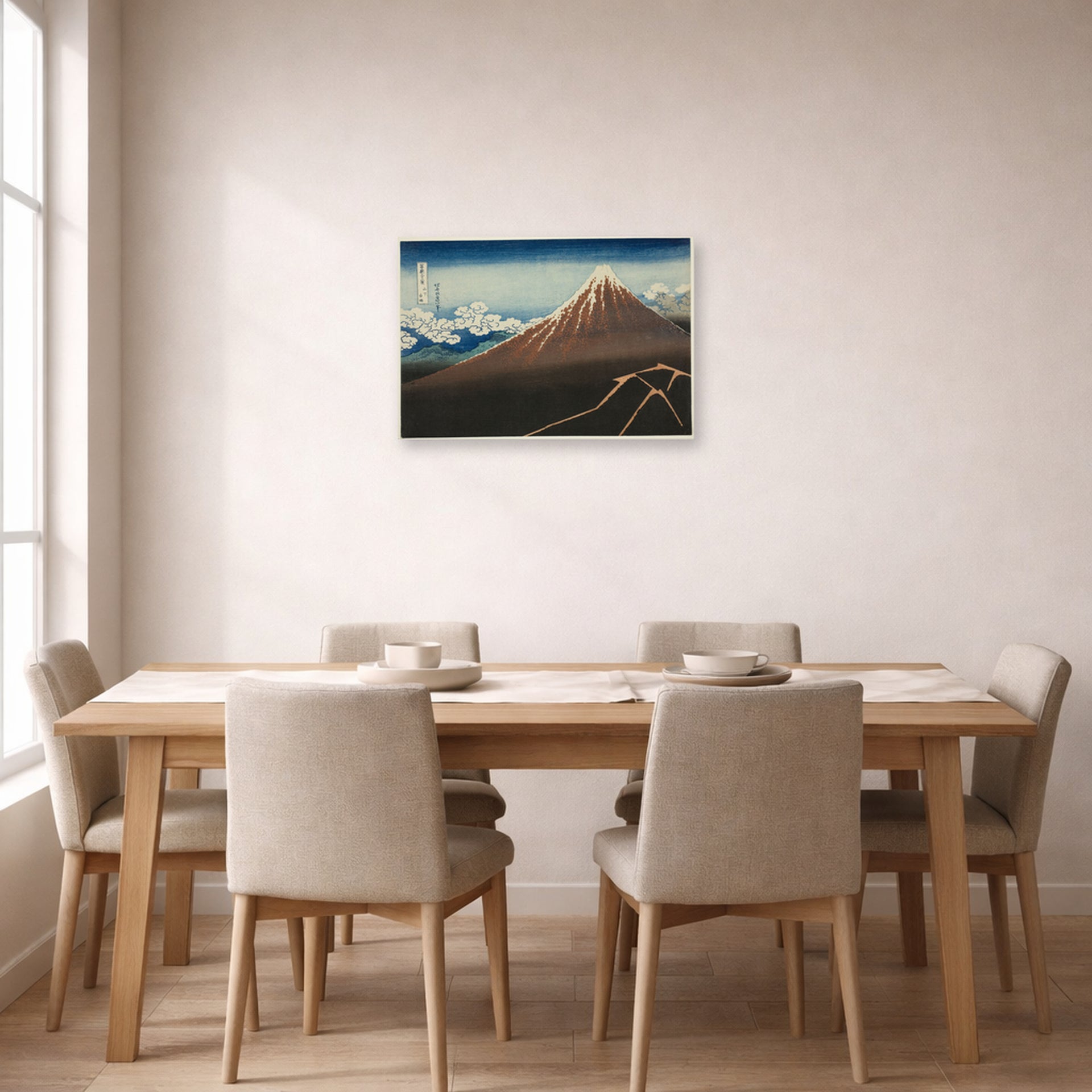 Unframed poster print of Katsushika Hokusai's Shower Below the Summit displayed on a wall in a dining room