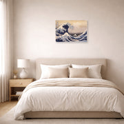 Unframed poster print of Katsushika Hokusai's The Great Wave Off the Coast of Kanagawa displayed on a wall in a bedroom
