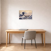 Unframed poster print of Katsushika Hokusai's The Great Wave Off the Coast of Kanagawa displayed on a wall in a office