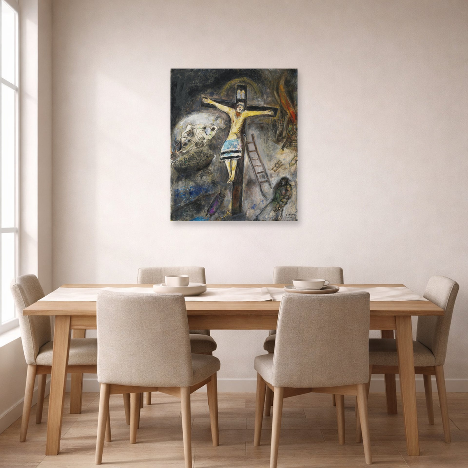 Unframed poster print of Marc Chagall's Crucifixion displayed on a wall in a dining room