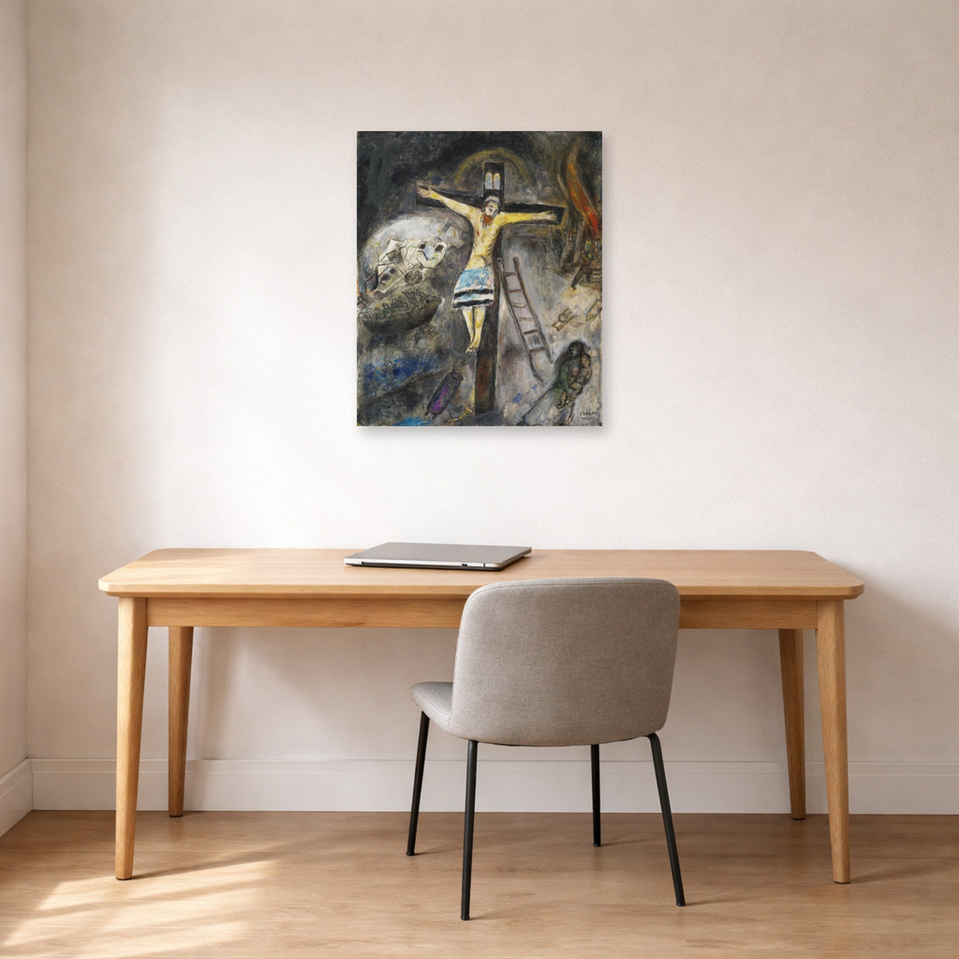 Unframed poster print of Marc Chagall's Crucifixion displayed on a wall in an office
