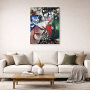 Gallery-wrapped canvas print of Marc Chagall's I and the Village displayed on a wall in a living room