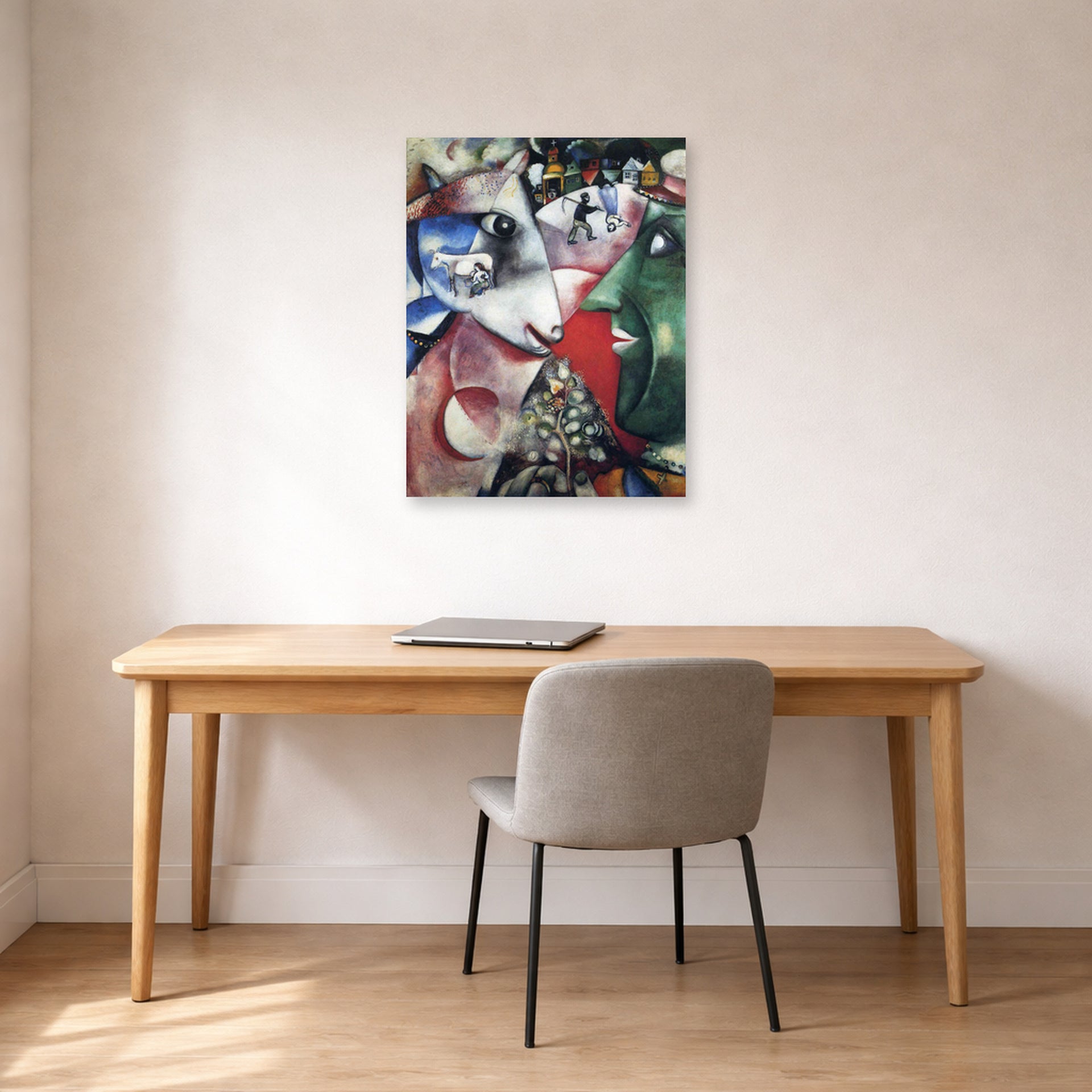 Unframed poster print of Marc Chagall's I and the Village displayed on a wall in an office