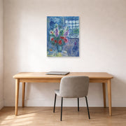 Unframed poster print of Marc Chagall's Latelier displayed on a wall in an office
