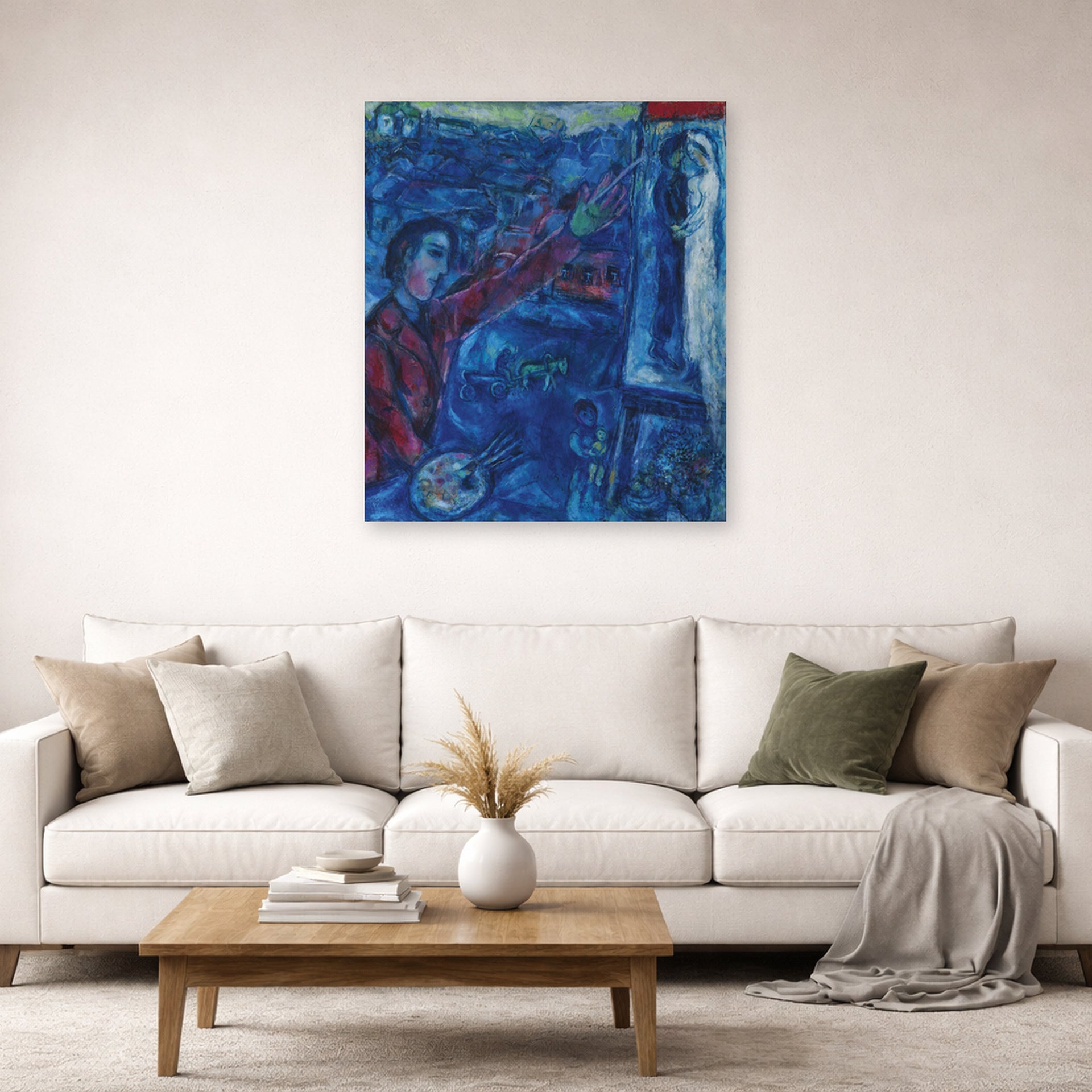 Unframed poster print of Marc Chagall's Le Peintre Devant Le Chevalet displayed on a wall in a living room