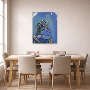 Unframed poster print of Marc Chagall's Le Violoniste Bleu displayed on a wall in a dining room