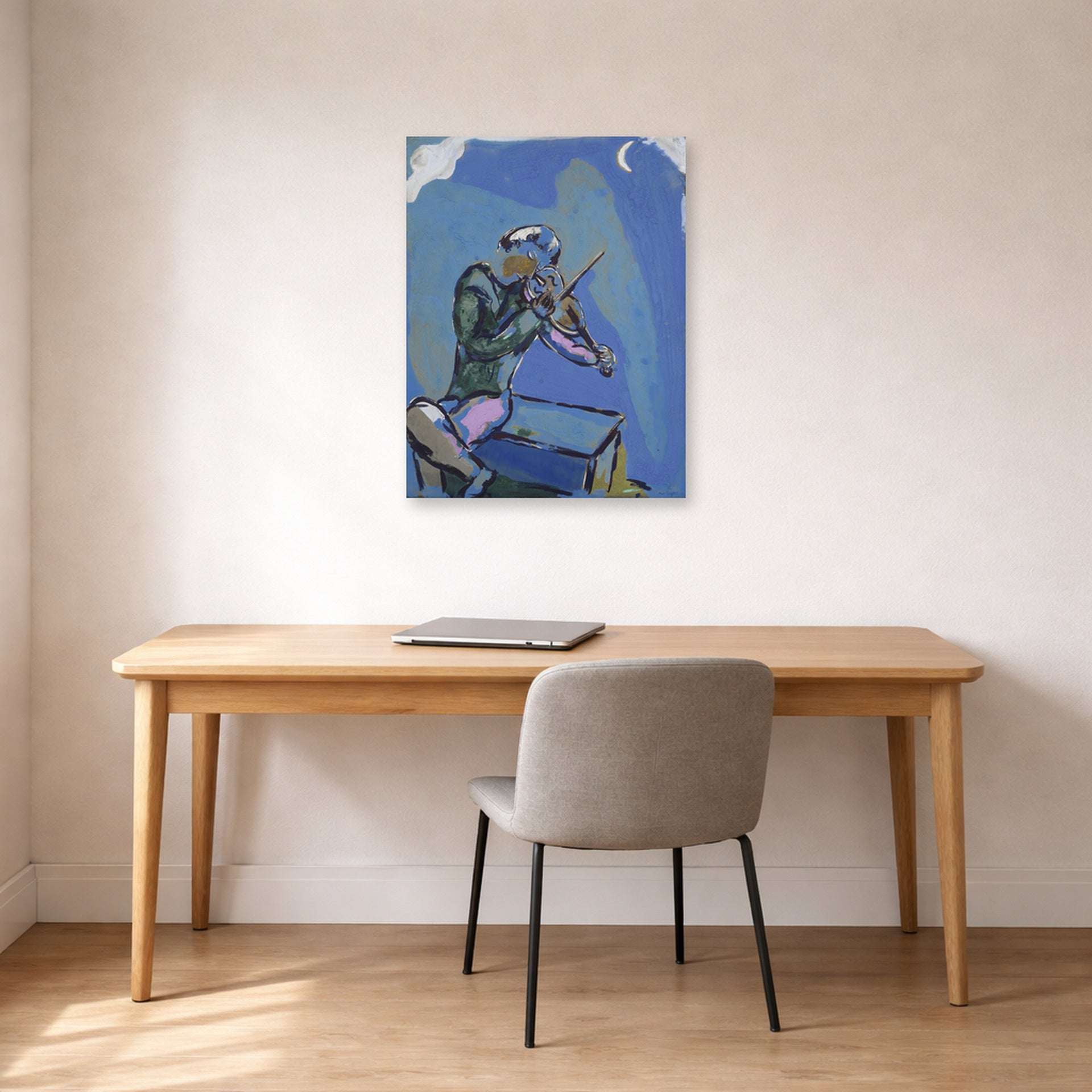Unframed poster print of Marc Chagall's Le Violoniste Bleu displayed on a wall in an office
