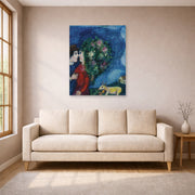 Unframed poster print of Marc Chagall's Les Amoureux Au Bouquet displayed on a wall in a living room