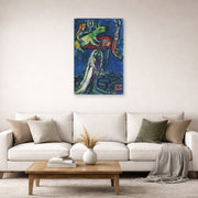 Unframed poster print of Marc Chagall's Les Maries a L'Ane Vert displayed on a wall in a living room