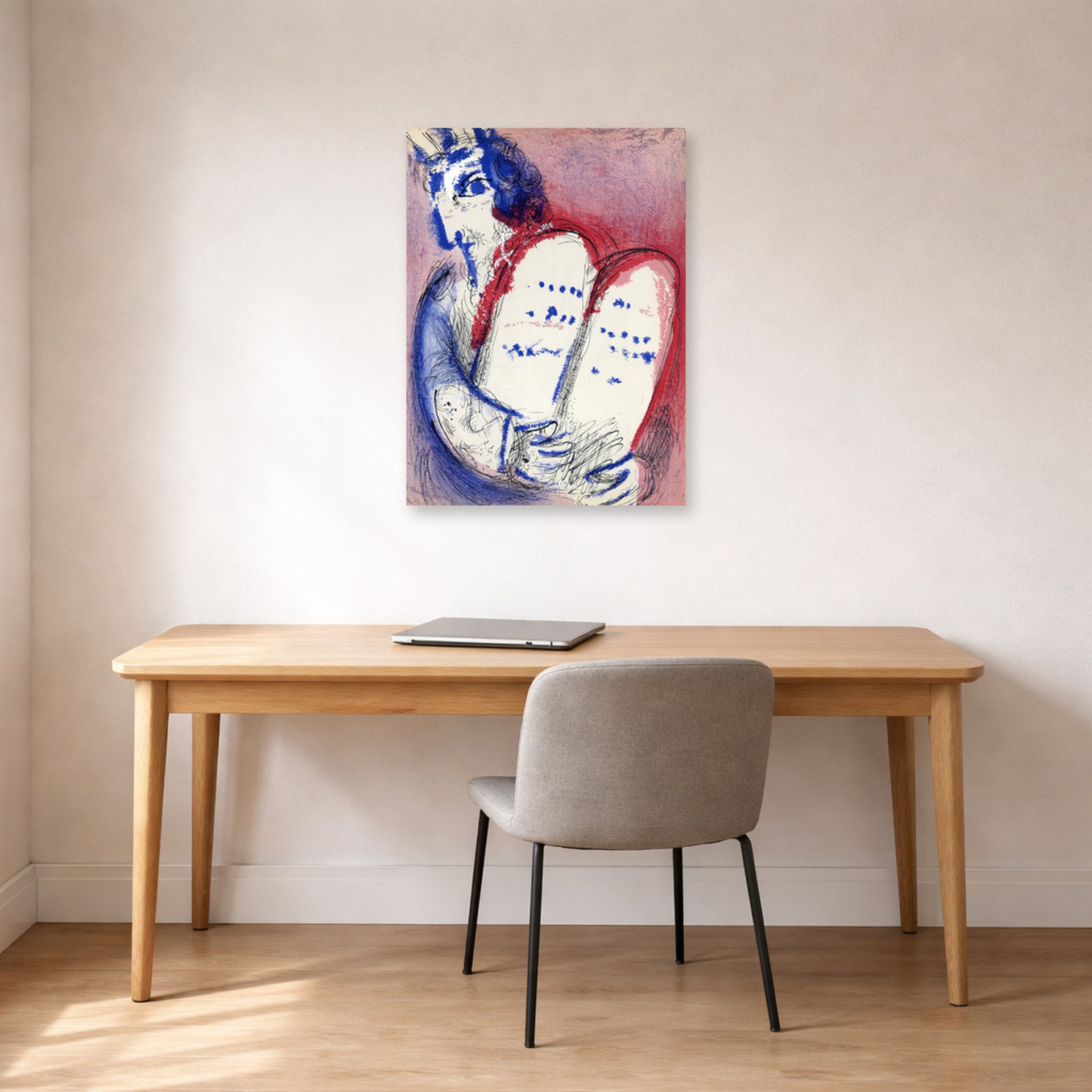 Unframed poster print of Marc Chagall's Moses with the Tablets of Law displayed on a wall in an office
