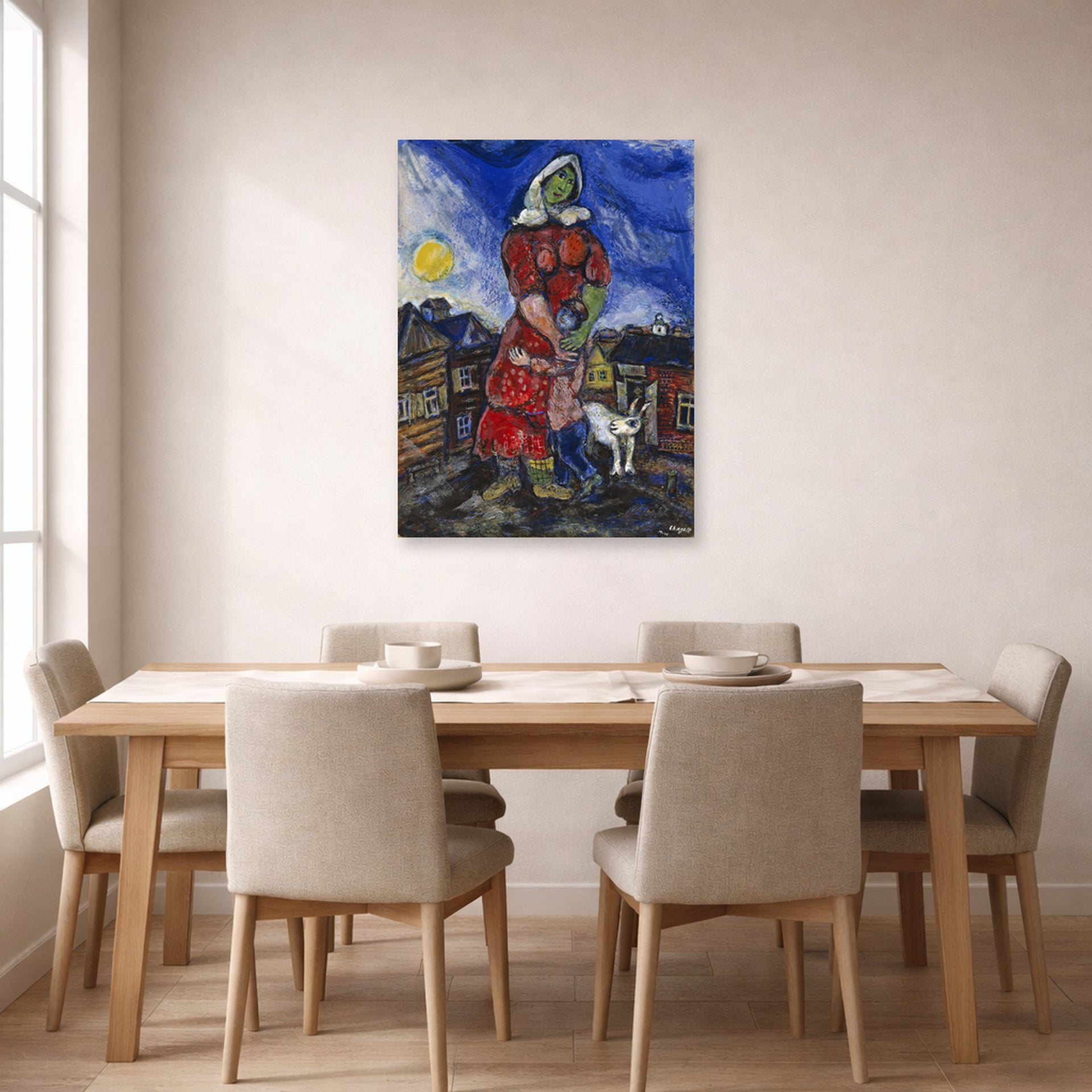Unframed poster print of Marc Chagall's Mother and Child displayed on a wall in a dining room
