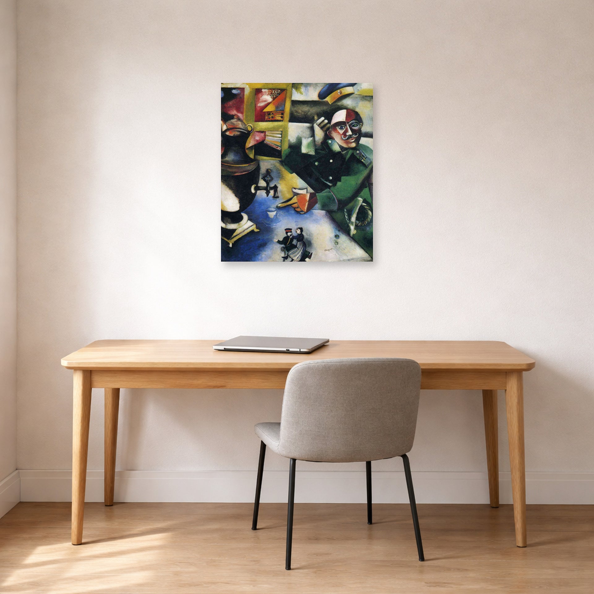 Unframed poster print of Marc Chagall's The Soldier Drinks displayed on a wall in an office