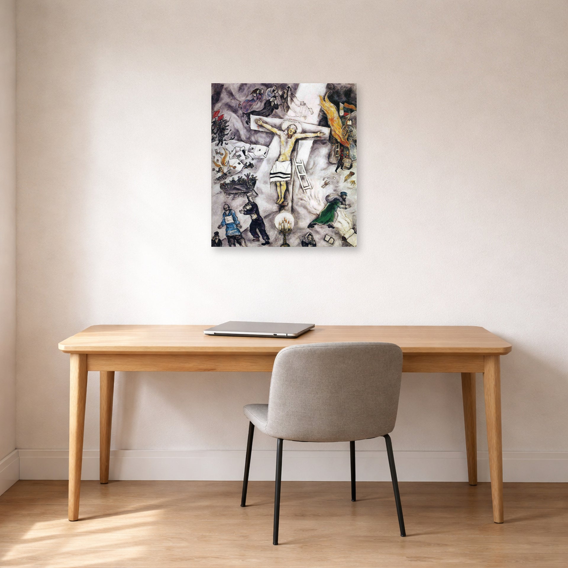 Unframed poster print of Marc Chagall's White Crucifixion displayed on a wall in an office