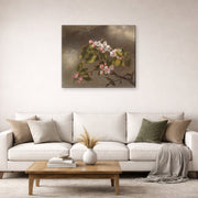Gallery-wrapped canvas print of Martin Johnson Heade's 'Hummingbird and Apple Blossoms' displayed on a wall in a living room