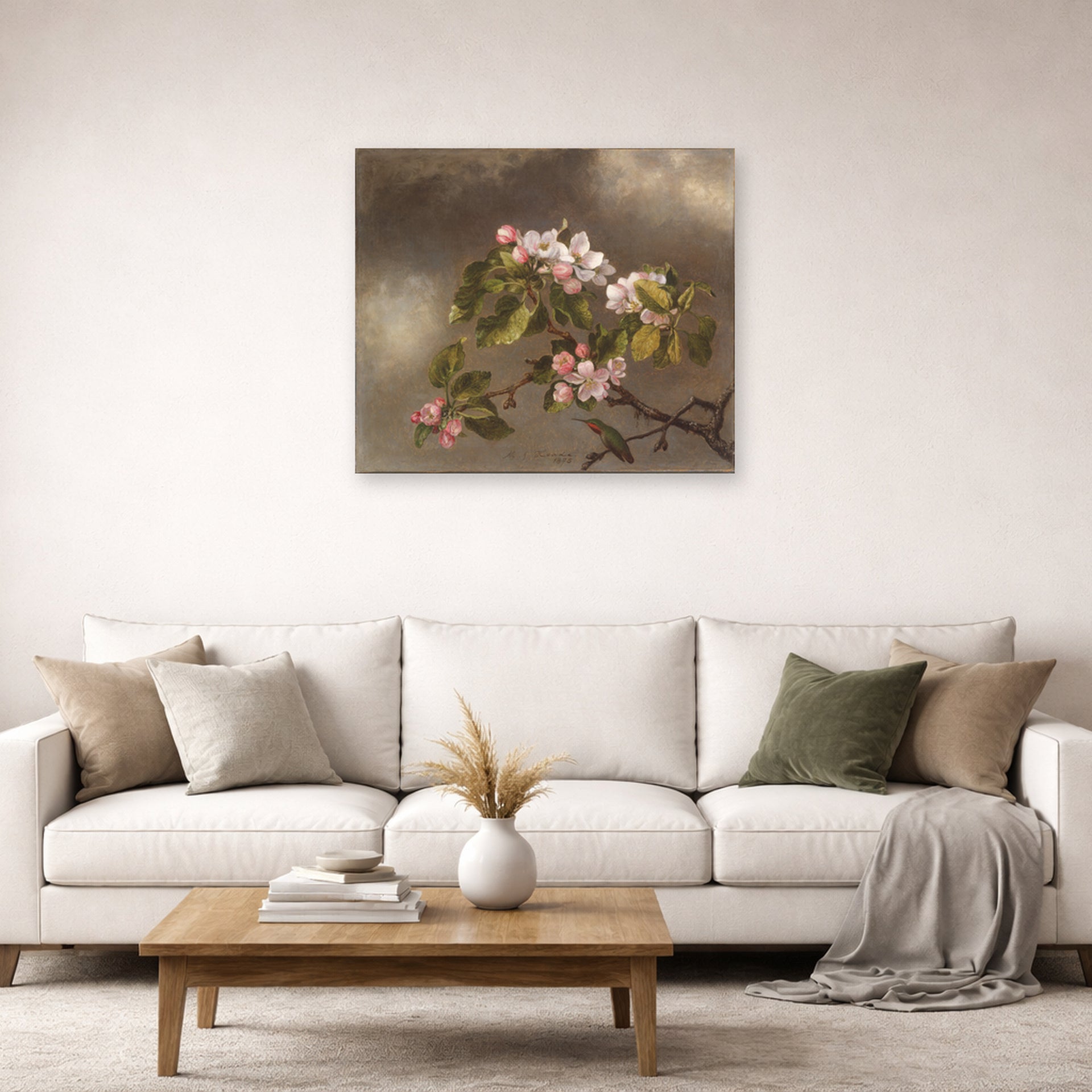 Unframed poster print of Martin Johnson Heade's 'Hummingbird and Apple Blossoms' displayed on a wall in a living room
