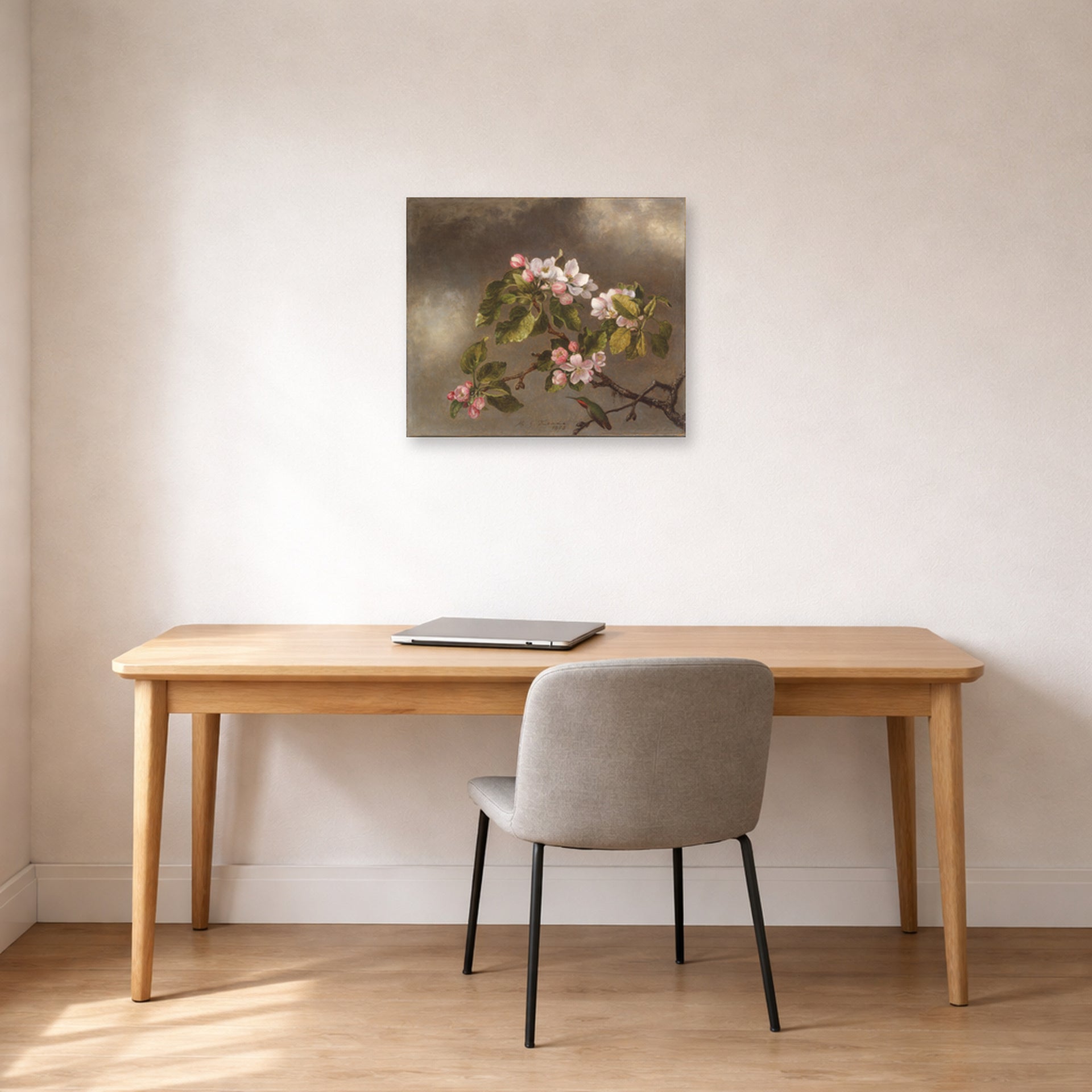 Unframed poster print of Martin Johnson Heade's 'Hummingbird and Apple Blossoms' displayed on a wall in a office